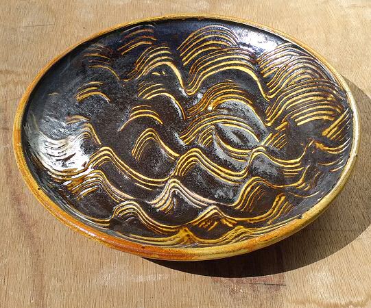 Deborah Prosser - 15in shallow dish with thick treacle glaze combed wet revealing white slip below