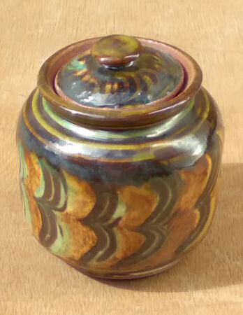 Deborah Prosser - Small lidded jar, earthenware, combed slip with under glaze oxides and stains